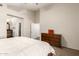 Bright bedroom with ample natural light, a ceiling fan, and a dresser at 11411 W Dana Ln, Avondale, AZ 85392
