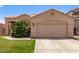 Charming single-story home with a well-maintained lawn and a neutral-toned exterior at 11411 W Dana Ln, Avondale, AZ 85392