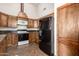 Well-lit kitchen with stainless steel appliances and unique cabinetry at 11411 W Dana Ln, Avondale, AZ 85392