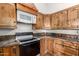 Kitchen with granite countertops and custom wood cabinetry at 11411 W Dana Ln, Avondale, AZ 85392