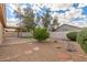 Back yard with gravel landscaping, covered patio, and white block wall at 13414 E Cindy St, Chandler, AZ 85225