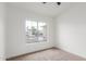 Bright bedroom featuring a large window with neighborhood views and neutral carpet at 13414 E Cindy St, Chandler, AZ 85225