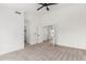A bright bedroom with neutral carpet, fresh paint and large doorway to other parts of the home at 13414 E Cindy St, Chandler, AZ 85225