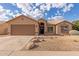 Charming single-story home with a two-car garage, desert landscaping, and neutral exterior paint at 13414 E Cindy St, Chandler, AZ 85225