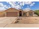 Charming single-story home with a two-car garage, desert landscaping, and neutral exterior paint at 13414 E Cindy St, Chandler, AZ 85225