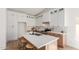 Bright kitchen featuring white cabinets, stainless steel appliances, island with seating, and modern fixtures at 13414 E Cindy St, Chandler, AZ 85225