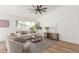 Bright living room with a large window, a comfortable sofa, and stylish decor, creating a cozy atmosphere at 13414 E Cindy St, Chandler, AZ 85225