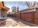 A spacious backyard with brick and gravel features and privacy fencing at 146 E 1St St, Mesa, AZ 85201