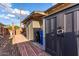 Cozy backyard featuring a brick pathway, storage shed, and convenient access to trash receptacles at 146 E 1St St, Mesa, AZ 85201