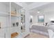 Bright bedroom with walk-in closet space adjacent to living area, features modern shelving and ample natural light at 146 E 1St St, Mesa, AZ 85201