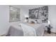 Comfortable bedroom with stylish city mural, plush bedding, and a serene atmosphere for relaxation and rest at 146 E 1St St, Mesa, AZ 85201