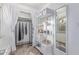 Walk-in closet with curtained clothing rack and custom shelving, optimizing organization and storage in a bedroom at 146 E 1St St, Mesa, AZ 85201
