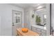 Bright dining area, illuminated by natural light, featuring a charming breakfast bar and seamless flow to the kitchen at 146 E 1St St, Mesa, AZ 85201