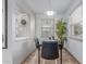 Cozy dining area with a modern table set and view of greenery through the window at 146 E 1St St, Mesa, AZ 85201