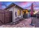 Charming exterior with brick accents, a cozy patio setup, and neatly landscaped surroundings at 146 E 1St St, Mesa, AZ 85201