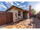 Charming exterior view showcases brick accents, outdoor seating and a well-maintained patio at 146 E 1St St, Mesa, AZ 85201