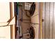Efficient laundry area with stacked washer/dryer, shelving, and essential utility hookups at 146 E 1St St, Mesa, AZ 85201