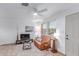 Bright living room featuring tile flooring, a ceiling fan, and comfortable seating at 146 E 1St St, Mesa, AZ 85201