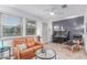 Inviting living room with tile floors, comfortable sofa, and natural light from windows at 146 E 1St St, Mesa, AZ 85201