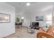 Cozy living room featuring tile floors, a plush rug, and comfortable seating area at 146 E 1St St, Mesa, AZ 85201