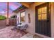Cozy patio with charming brickwork, small table, and stylish seating near the entrance at 146 E 1St St, Mesa, AZ 85201