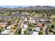 Beautiful aerial view of the neighborhood with lush green landscaping and mountains in the distance at 14802 N 3Rd Ave, Phoenix, AZ 85023