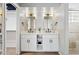 Beautifully renovated bathroom featuring dual sinks, elegant fixtures, and ample cabinet space at 14802 N 3Rd Ave, Phoenix, AZ 85023