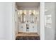 Stylish bathroom with double sinks, modern lighting, and a decorative black and white rug at 14802 N 3Rd Ave, Phoenix, AZ 85023