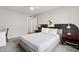 Bedroom with gray bed frame, decorative lamps and a painting at 14802 N 3Rd Ave, Phoenix, AZ 85023