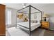 Bedroom featuring a four-poster bed with side tables and hat decorations on the wall at 14802 N 3Rd Ave, Phoenix, AZ 85023