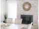 Elegant dining area with a fireplace, stylish decor, and abundant natural light at 14802 N 3Rd Ave, Phoenix, AZ 85023