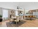 Open dining area with fireplace, views into the kitchen, and a large dining table at 14802 N 3Rd Ave, Phoenix, AZ 85023