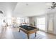 Spacious game room with a pool table, adjacent dining area, and plenty of natural light at 14802 N 3Rd Ave, Phoenix, AZ 85023