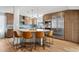 Stylish kitchen featuring an island with seating, stainless steel appliances, and tile backsplash at 14802 N 3Rd Ave, Phoenix, AZ 85023
