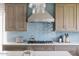 Modern kitchen featuring sleek countertops, stainless steel appliances, and stylish tile backsplash at 14802 N 3Rd Ave, Phoenix, AZ 85023