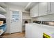Laundry room with cabinets, shelves, washer and dryer at 14802 N 3Rd Ave, Phoenix, AZ 85023
