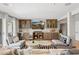 Bright living room with hardwood floors, modern furniture, built in cabinets and a stylish wet bar at 14802 N 3Rd Ave, Phoenix, AZ 85023
