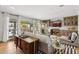 Bright living room with hardwood floors, modern furniture, and stylish bar area at 14802 N 3Rd Ave, Phoenix, AZ 85023