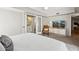 Tranquil main bedroom with a bright white wall, neutral furniture, and an ensuite bathroom at 14802 N 3Rd Ave, Phoenix, AZ 85023