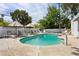 Sparkling swimming pool surrounded by lounge chairs, ideal for enjoying the sunny weather at 14802 N 3Rd Ave, Phoenix, AZ 85023