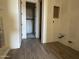 Unfinished bathroom features wood-style tile flooring, closet, and plumbing fixtures awaiting finishing touches at 15792 W Beryl Ave, Waddell, AZ 85355