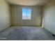 Unfinished bedroom featuring a window and bare drywall awaiting customization at 15792 W Beryl Ave, Waddell, AZ 85355