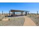 Gathering spot under shaded ramada with picnic tables and landscaping at 15792 W Beryl Ave, Waddell, AZ 85355