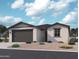 Charming single-story home with a two-car garage and well-maintained desert landscaping at 15792 W Beryl Ave, Waddell, AZ 85355