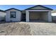 Charming single-Gathering home featuring an attached two-car garage and a well-lit window at 15792 W Beryl Ave, Waddell, AZ 85355