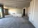 Large Living Room space with ample natural light, awaiting design and finishing touches at 15792 W Beryl Ave, Waddell, AZ 85355