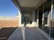 Covered patio with sliding glass doors offering seamless transition to outdoor living space at 15792 W Beryl Ave, Waddell, AZ 85355