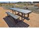 Close up on a park picnic table with bench seating in common area at 15792 W Beryl Ave, Waddell, AZ 85355