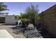 Serene backyard with lounge chairs and desert landscaping, offering a peaceful outdoor retreat at 1623 E Krystal St, Casa Grande, AZ 85122
