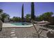 Expansive backyard showcasing a sparkling pool and desert landscaping, creating a private outdoor escape at 1623 E Krystal St, Casa Grande, AZ 85122
